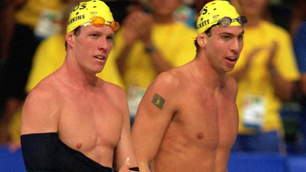 Kieren Perkins and Grant Hackett of Australia celebrates their silver and gold medals in the men's 1500m freestyle final held at the Sydney International Aquatic Centre during the Sydney 2000 Olympics.
