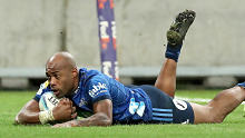Mark Telea of the Blues scores a try.