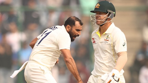 Mohammed Shami of India celebrates taking the wicket of David Warner.