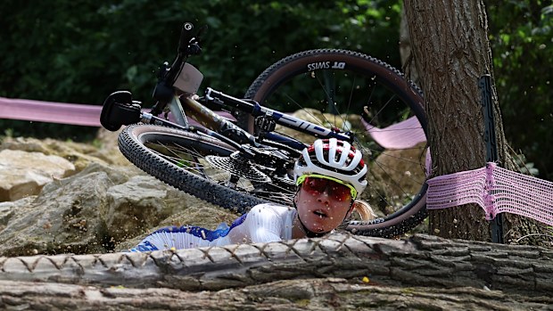Loana Lecomte of Team France reacts after crashing during the Womens Cross-Country Cycling Mountain Bike