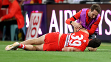 SYDNEY, AUSTRALIA - APRIL 08: Paddy McCartin of the Swans receives attention from a trainer during the round four AFL match between Sydney Swans and Port Adelaide Power at Sydney Cricket Ground, on April 08, 2023, in Sydney, Australia. (Photo by Brendon Thorne/AFL Photos/via Getty Images )