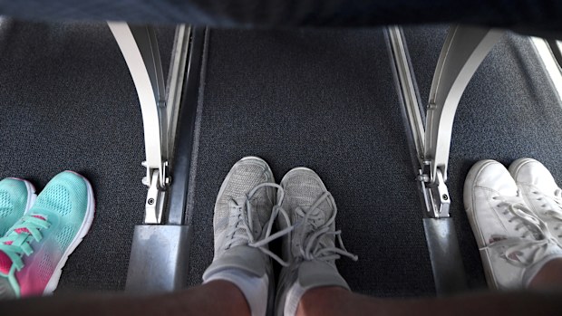 Interior view of the legroom on a commercial airplane.