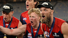 Clayton Oliver and Max Gawn after the 2021 AFL premiership.