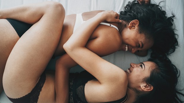 Couple embracing in bed