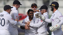 KARACHI, PAKISTAN - DECEMBER 19: Rehan Ahmed of England is congratulated on the wicket of Mohammad Rizwan of Pakistan during day three of the Third Test between Pakistan and England at Karachi National Stadium on December 19, 2022 in Karachi, Pakistan. (Photo by Matthew Lewis/Getty Images)