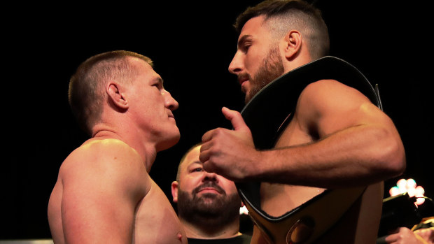 Paul Gallen faces off with opponent Kris Terzievski during the King of the Castle weigh-in at Civic Theatre in Newcastle.