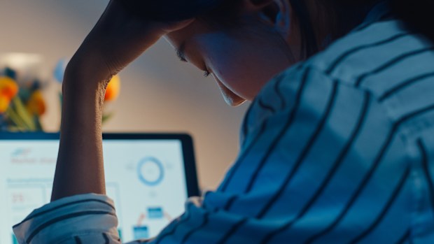 Young asian lady employee work overtime late night stress finance accounting project research on laptop at home. Girl student learn online at house, Social Distance, New normal work from home concept.