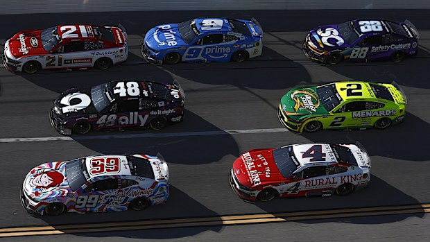 Austin Cindric, driver of the #2 Ford and Shane Van Gisbergen, driver of the #88 Chevrolet, race during the NASCAR Cup Series.