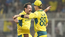 Australia's Travis Head celebrates the wicket of South Africa's Marco Jansen with Adam Zampa during the ICC Men's Cricket World Cup second semifinal match between Australia and South Africa in Kolkata, India, Thursday, Nov.16, 2023. (AP Photo/Aijaz Rahi)