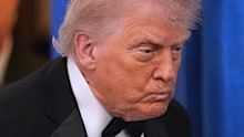 President Donald Trump with first lady Melania Trump, walks in to speak in the James Brady Press Briefing Room at the White House after an unspecified threat at the annual White House Correspondents' Association Dinner in Washington, Saturday, April 25, 2026.