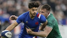 Romain Ntamack of France passes the ball as he is tackled by Ireland's Jack Conan during the Six Nations.