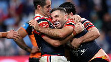 SYDNEY, AUSTRALIA - JUNE 30: James Tedesco of the Roosters celebrates with team mates after scoring a try during the round 17 NRL match between Sydney Roosters and Wests Tigers at Allianz Stadium, on June 30, 2024, in Sydney, Australia. (Photo by Brendon Thorne/Getty Images)