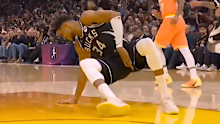 Giannis Antetokounmpo clutches at his left groin. 