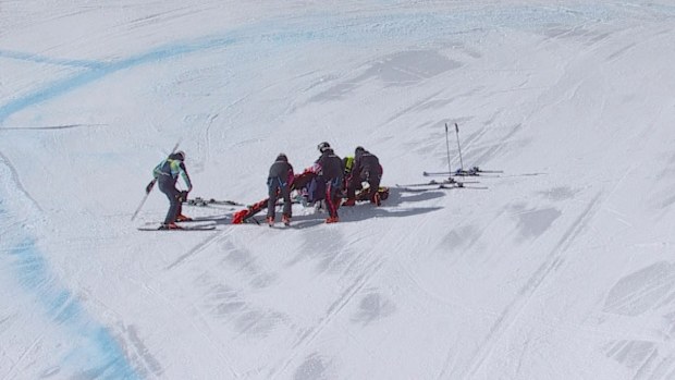 Lindsey Vonn is assisted by medics after crashing in the downhill final.