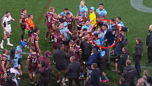 Haumole Olakau'atu grabs Valentine Holmes during a scuffle. 