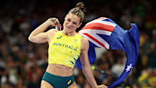 Nina Kennedy leaps for joy after winning Olympic gold in Paris.