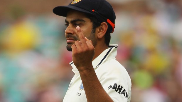 Virat Kohli flips off at a heckling SCG crowd during the Sydney Test of 2012.
