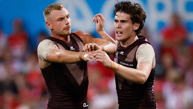 Will Day celebrates a goal with Hawthorn teammate James Worpel.