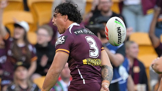 Kotoni Staggs celebrates after scoring a try during the round 17 NRL match between the Broncos and the Warriors.