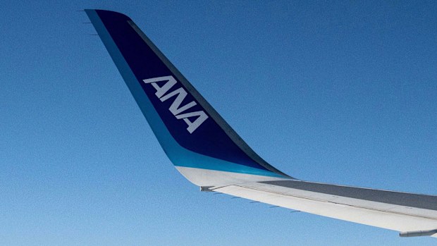 	The wing of an an All Nippon Airways (ANA) aircraft is seen during a flight above Japan's Shizuoka prefecture on December 9, 2024. A flight from Tokyo to Houston was diverted to Seattle on May 25 after a passenger tried to open an exit on the plane in flight, according to the FBI and a spokesperson for the Port of Seattle.