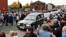 The hearse stops outside Hatton's boxing gym.