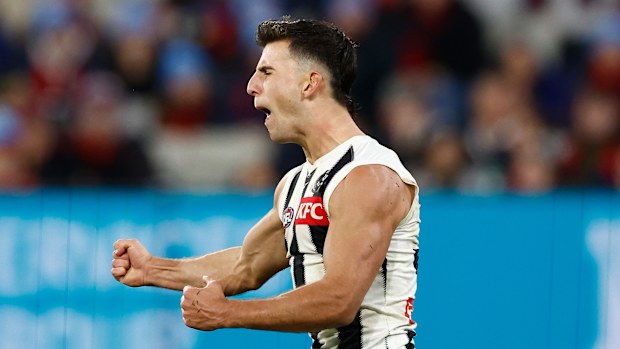 Nick Daicos celebrates a goal.