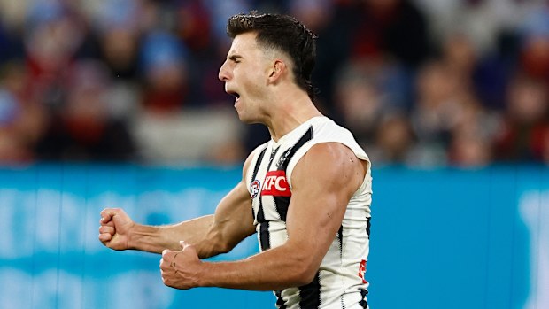 Nick Daicos celebrates a goal.