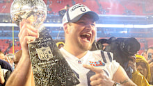 Ulrich holding the Super Bowl trophy.