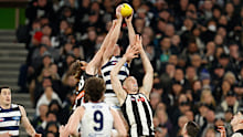 Geelong's Gary Rohan marks the ball over Darcy Cameron of the Magpies.