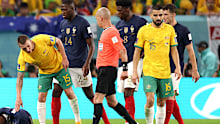 Ousmane Dembele of France lies on the pitch after a challenged by Mitchell Duke of Australia. (Photo by Elsa/Getty Images)