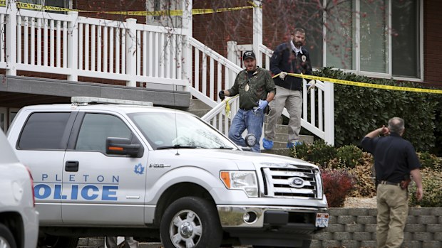 Members of Mapleton Police Department and forensics gather evidence at a home in Mapleton, Utah. (AAP)