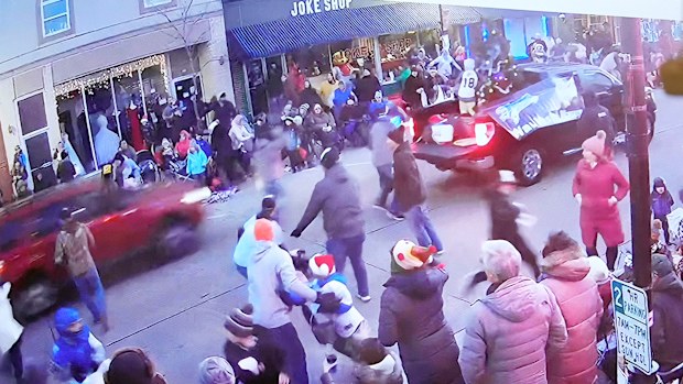 A video is shown of Jeff Rogers, who was walking in the parade with his children and baseball team, including 8-year-old Jackson Sparks who was killed in the parade, just before a SUV hits their team.