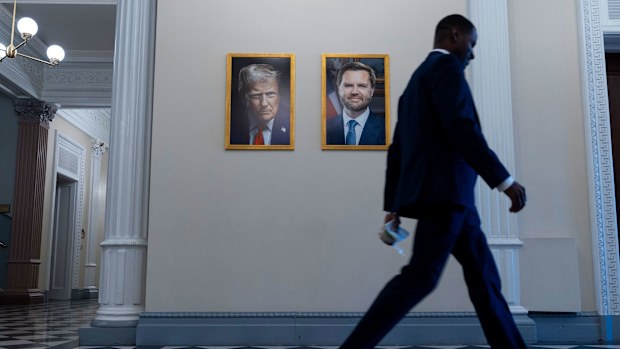 When President Donald Trump's new official portrait was unveiled Monday, it lacked two elements his predecessors had featured in their photographs dating back more than 50 years: a happy expression and an American flag in the background.