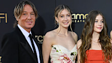 The former couple's endest daughter Sunday Rose (centre) has seemingly unfollowed her father on Instagram.