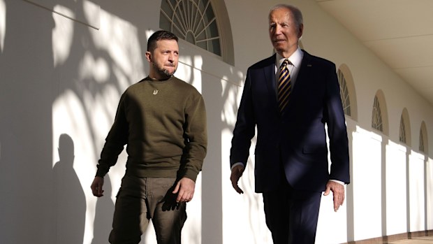 President Joe Biden, right, and Ukraine President Volodymyr Zelenskyy walk down the Colonnade as they make their way to the Oval Office at the White House on December 21 in  2022 in Washington, DC. 