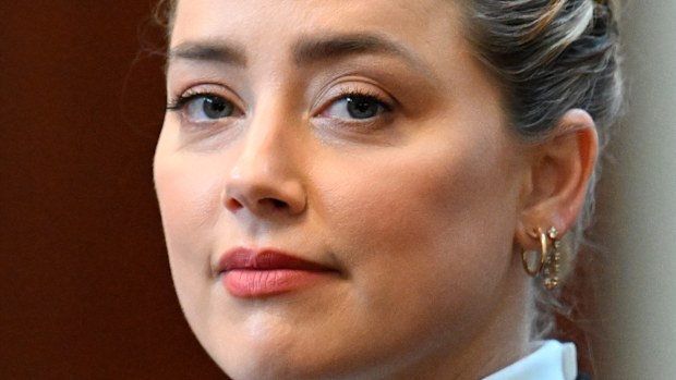 Actress Amber Heard listens in the courtroom.