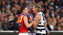 Logan Morris of the Lions and Mark Blicavs of the Cats exchange words