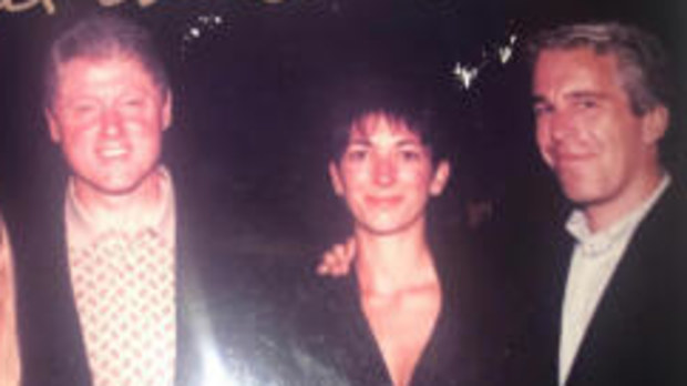 This undated photo released by Democrats on the House Oversight Committee shows former President Bill Clinton, Ghislaine Maxwell and Jeffrey Epstein, with Clinton's signature at the top of the photo.