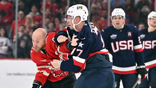 Brady Tkachuk #7 of Team USA and Sam Bennett #9 of Team Canada fight.