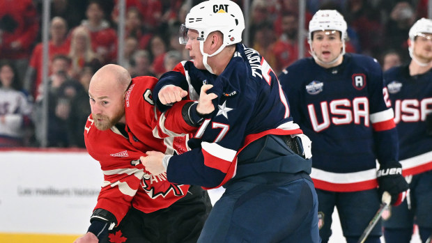 Brady Tkachuk #7 of Team USA and Sam Bennett #9 of Team Canada fight.