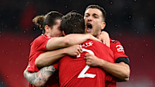Diogo Dalot of Manchester United celebrates with Victor Lindelof of Manchester United after winning the penalty shootout in the Emirates FA Cup Semi Final match between Brighton & Hove Albion v Manchester United at Wembley Stadium on April 23, 2023 in London, England. (Photo by Justin Setterfield - The FA/The FA via Getty Images)