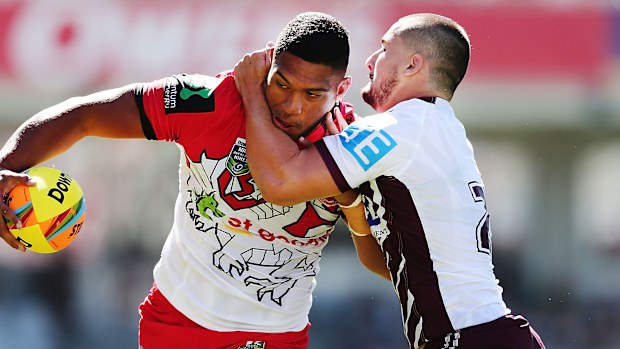 Cameron Cullen (right) attempts to tackle Taane Milne.