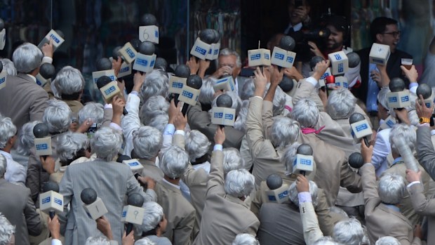 Bob Hawke being cheered on by Richie Benaud impersonators.
