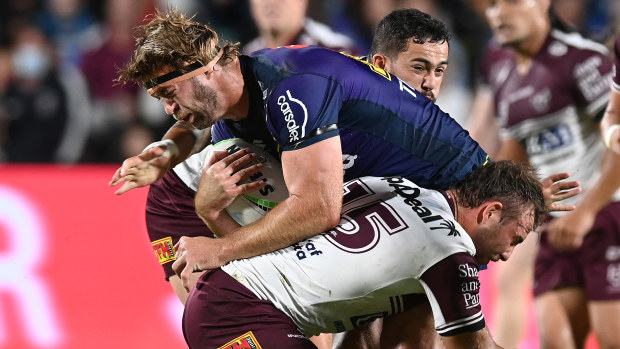 Christian Welch of the Storm is tackled during the NRL Qualifying Final between the Melbourne Storm and the Manly Warringah Sea Eagles at Sunshine Coast Stadium on September 10, 2021, in Sunshine Coast, Australia. (Photo by Bradley Kanaris/Getty Images