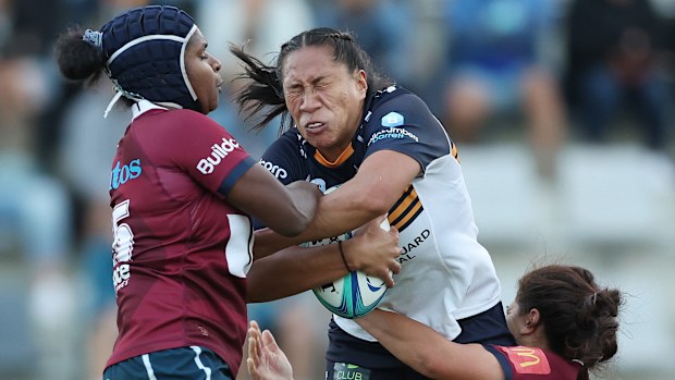 Siokapesi Palu of the Brumbies is tackled at Concord Oval.