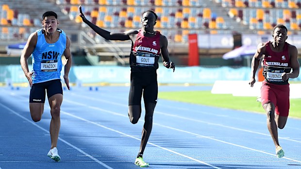 BRISBANE, AUSTRALIA - APRIL 18: Gout Gout waves to family and friends as he celebrates victory after competing in the final of the Men's U20's 100m event during the 2026 Australian Athletics Junior Championships at Queensland Sport and Athletics Centre on April 18, 2026 in Brisbane, Australia. (Photo by Bradley Kanaris/Getty Images)