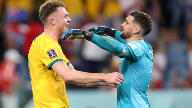 Harry Souttar and Mathew Ryan of Australia celebrate their 1-0 World Cup victory over Denmark.
