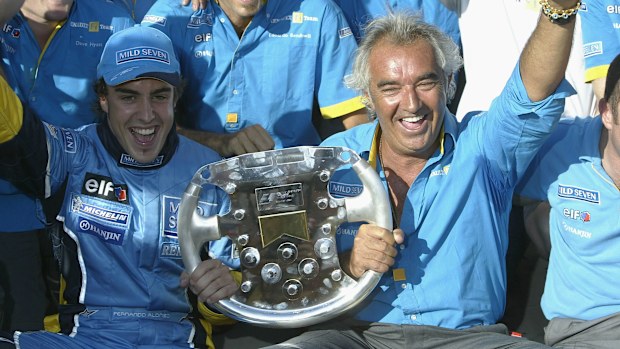 Fernando Alonso of Spain and Renault celebrates with Flavio Briatore and the Renault team after winning the Formula One Hungarian Grand Prix at the Hungaroring on August 24, 2003 in Budapest, Hungary.  (Photo by Mark Thompson/Getty Images)
