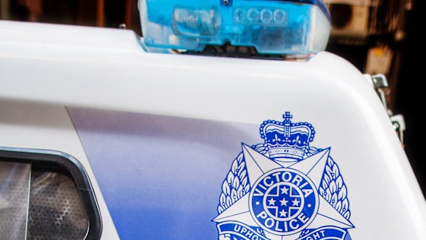 Melbourne, Australia - July 29, 2017: Closeup of Victoria Police vehicle with the badge and emergency number on it