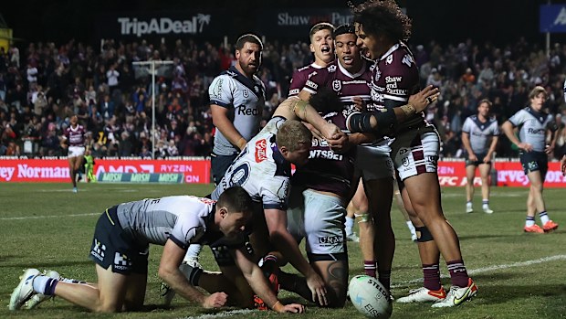 Haumole Olakau'atu of the Sea Eagles is congratulated after scoring a try.